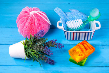 Objects for care of face skin: handmade natural soap, a sponge, the peeling brush and a massage...