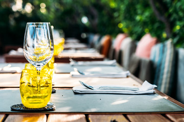 Wine glass with dining set prepare for breakfast lunch or dinner on table in restaurant