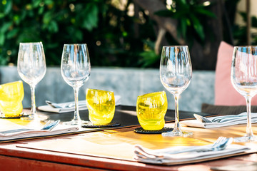 Wine glass with dining set prepare for breakfast lunch or dinner on table in restaurant