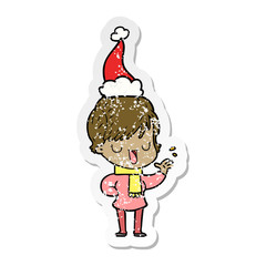 distressed sticker cartoon of a woman talking wearing santa hat