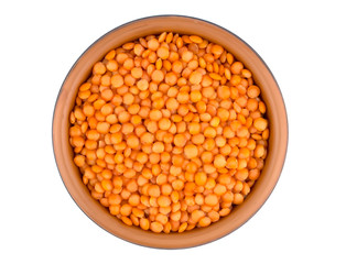 Red lentils in plate isolated on white background