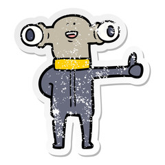 distressed sticker of a friendly cartoon alien