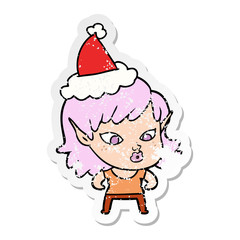 pretty distressed sticker cartoon of a elf girl wearing santa hat