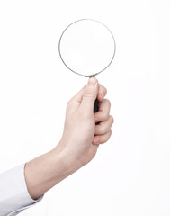 closeup of a businessman holding a magnifying glass
