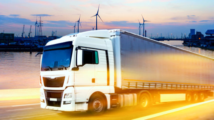 Truck on highway   .  Commercial transport .  truck transport container . Commercial transport .  truck transport container   . transportation of freight Europe . industrial infrastructure .