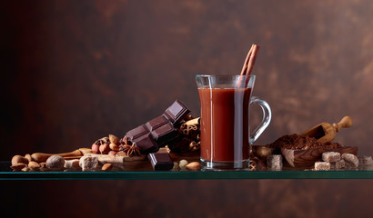 Cocoa with cinnamon, chocolate pieces and various spices.