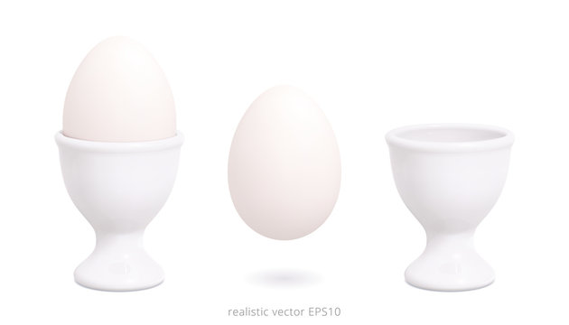 White porcelain or plastic egg cups. 3d realistic vector design of holder with a gradient mesh. Boiled blank chicken egg floats over white background. Empty template. White mock up. Detailed clipart