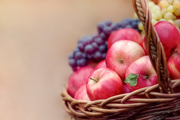 fruit basket of apples and grapes