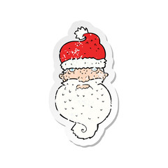retro distressed sticker of a cartoon grim santa face