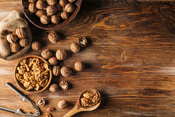 Tasty walnuts on wooden table