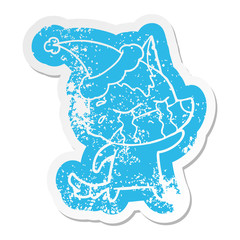 cartoon distressed sticker of a crying wolf wearing santa hat