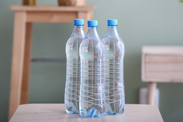 Bottles of water on table in room