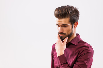 Studio shot portrait of pensive and worried businessman. 