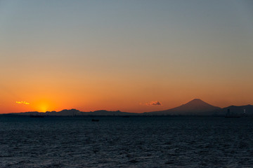 Naklejka na ściany i meble Sunset beyond mount Fuji, from Tokyo bay aqua-line