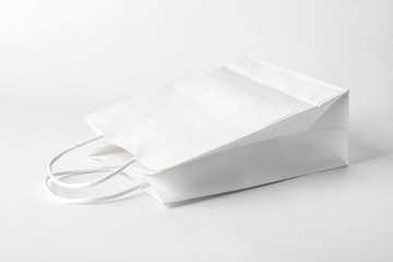 White shopping bag on light background