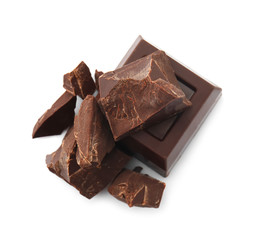 Pieces of tasty dark chocolate on white background