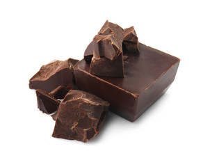 Pieces of tasty dark chocolate on white background