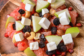 Healthy salad with feta cheese on plate, closeup