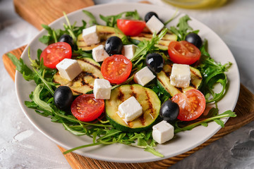 Healthy salad with feta cheese on plate