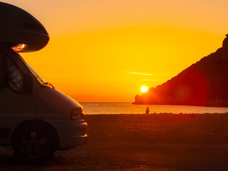 Fototapeta na wymiar Camper car on nature at sunrise. Travel