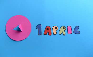 Composition for April Fool's Day on color background