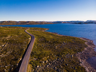 Road crossing Hardangervidda plateau, Norway. Aerial view.