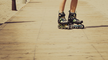 Woman legs wearing roller skates