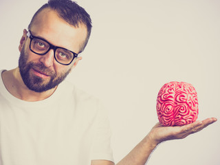 Man looking at human brain