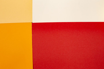 sheets of colored paper. Many colored sheets of paper are laid out in the harsh composition. background of colored paper. warm colors