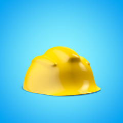 Fototapeta premium Construction yellow helmet on a blue background
