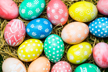 Easter eggs on the straw, Christian holiday of celebrates the belief in the resurrection of Jesus Christ