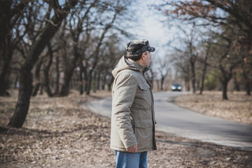 Senior man with a sad philosophical mood worried about something. The concept of life after 50 years, problems and depression. Crisis of middle age 