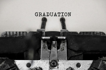 Graduation word with black and white typewriter concept