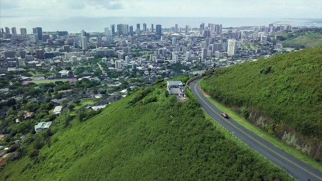 Aerial view of the scenic road Tantalus Drive and the city of Honolulu on the background. The island of Oahu, Hawaii