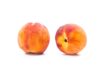 Group of ripe peach fruit isolated on white background.