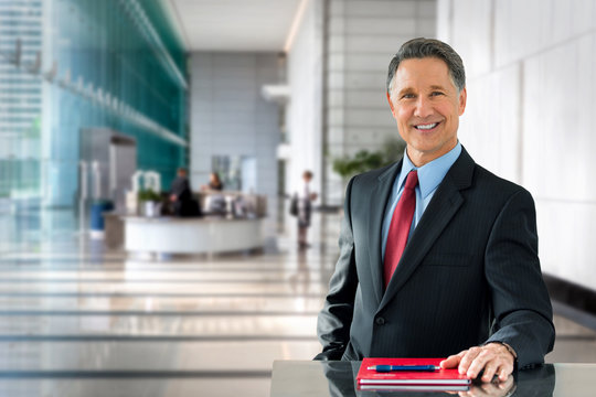 Corporate banking advisor, professional investment manager, businessman, greeting with welcoming smile in building lobby