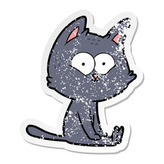 distressed sticker of a cartoon cat sitting