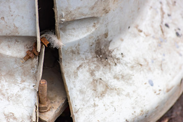 The rusty bolt with nut in broken street structure