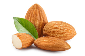 Close-up of almonds with leaves, isolated on white background