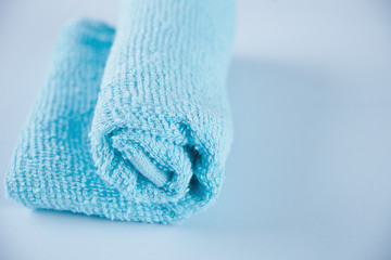 Blue towel spa cloth beach towel on blue background.