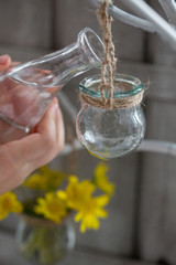 Children's hands water the flowers