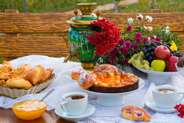 Tea with honey, pastries and samovar