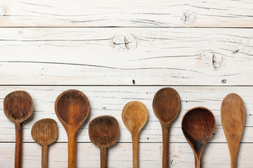 Vintage wooden spoons on rustic table