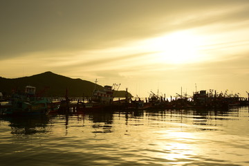 Fishing port view before sunset With beautiful golden yellow sky