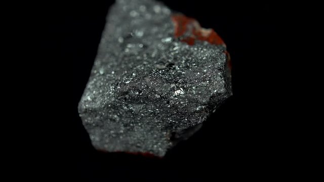 Seamlessly rotating a metallic-gray mineral (Hematite) in front of black background