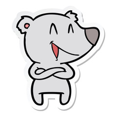 sticker of a laughing bear cartoon