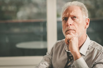 Thoughtful senior businessman