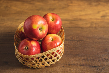 Red Fuji apple in the basket. Ingredients for making apple pie or tarte tatin.
