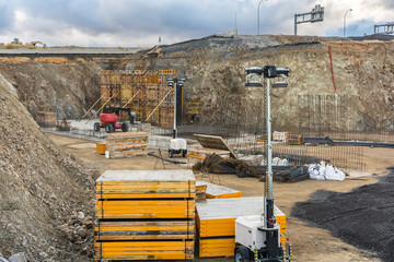 Construction of a bridge on a highway with different construction equipment