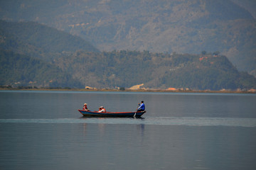 Boat floating in the lake.